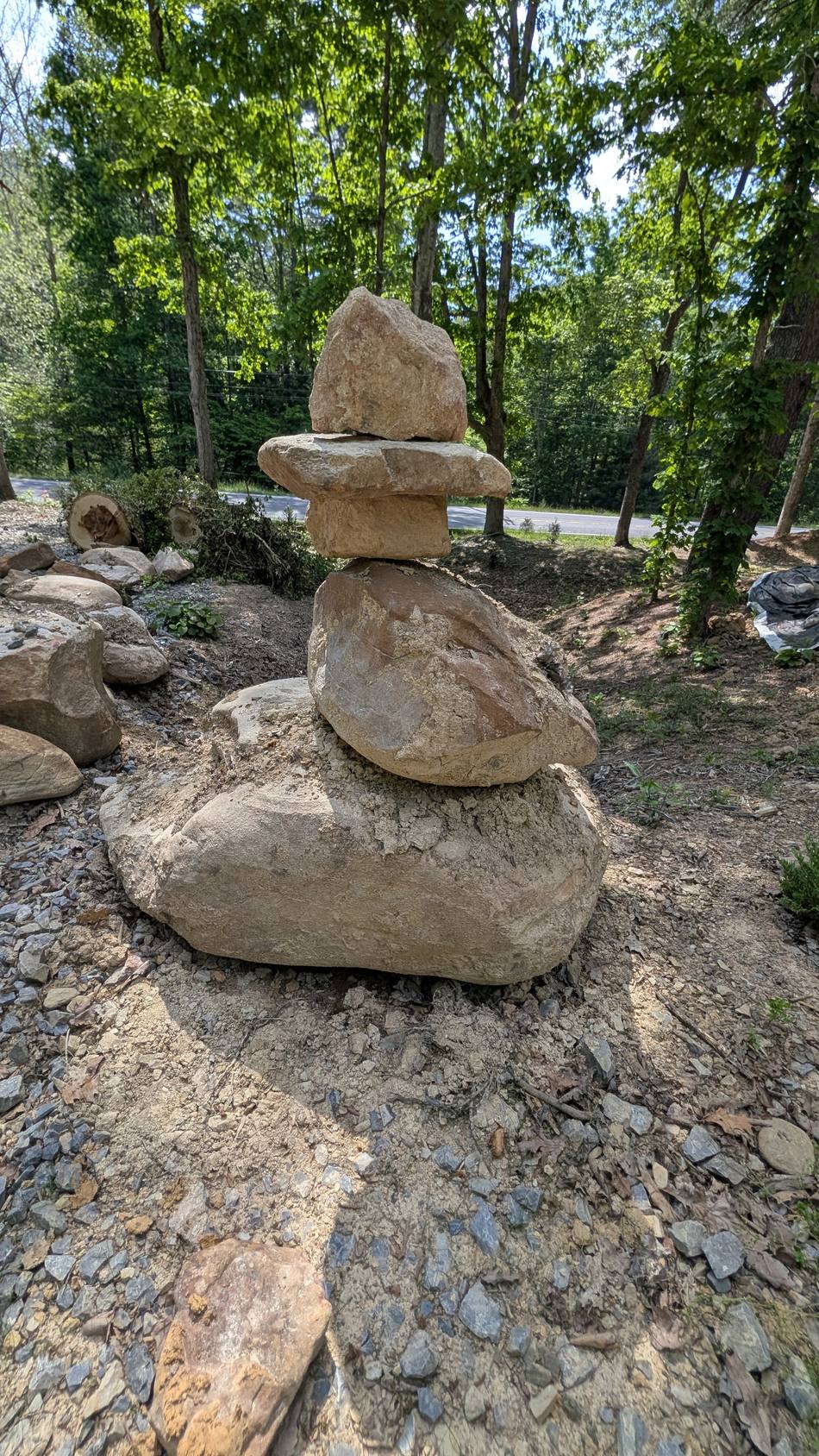 A hand-stacked stone cairn marking the garden entrance